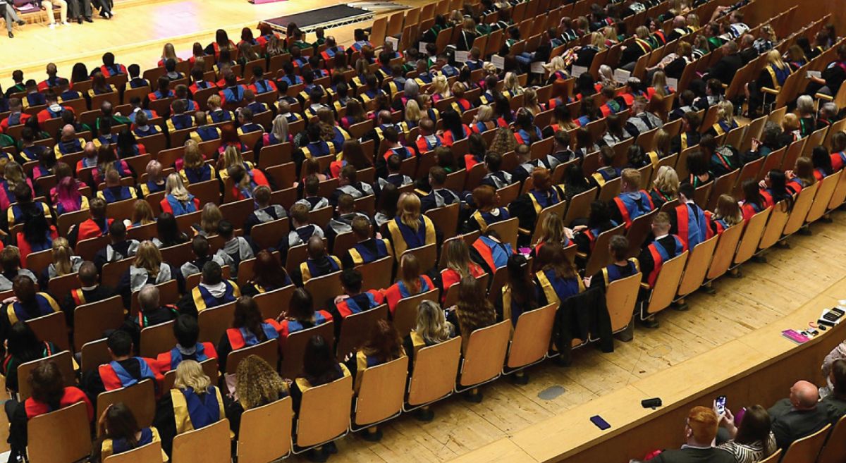 Group of Graduates sitting down. 